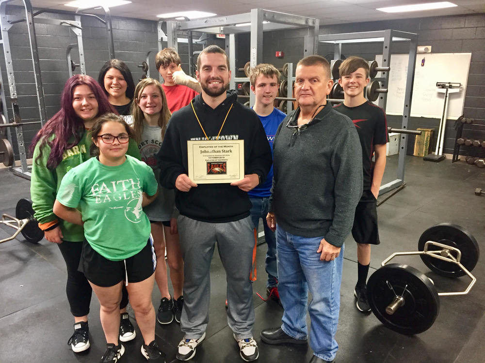 Mr. Stark awarded USD 235 October 2019 Employee of the Month. Mr. Stark is pictured with members of his 1st hour 9th grade PE class as well as AD Jim Mason.