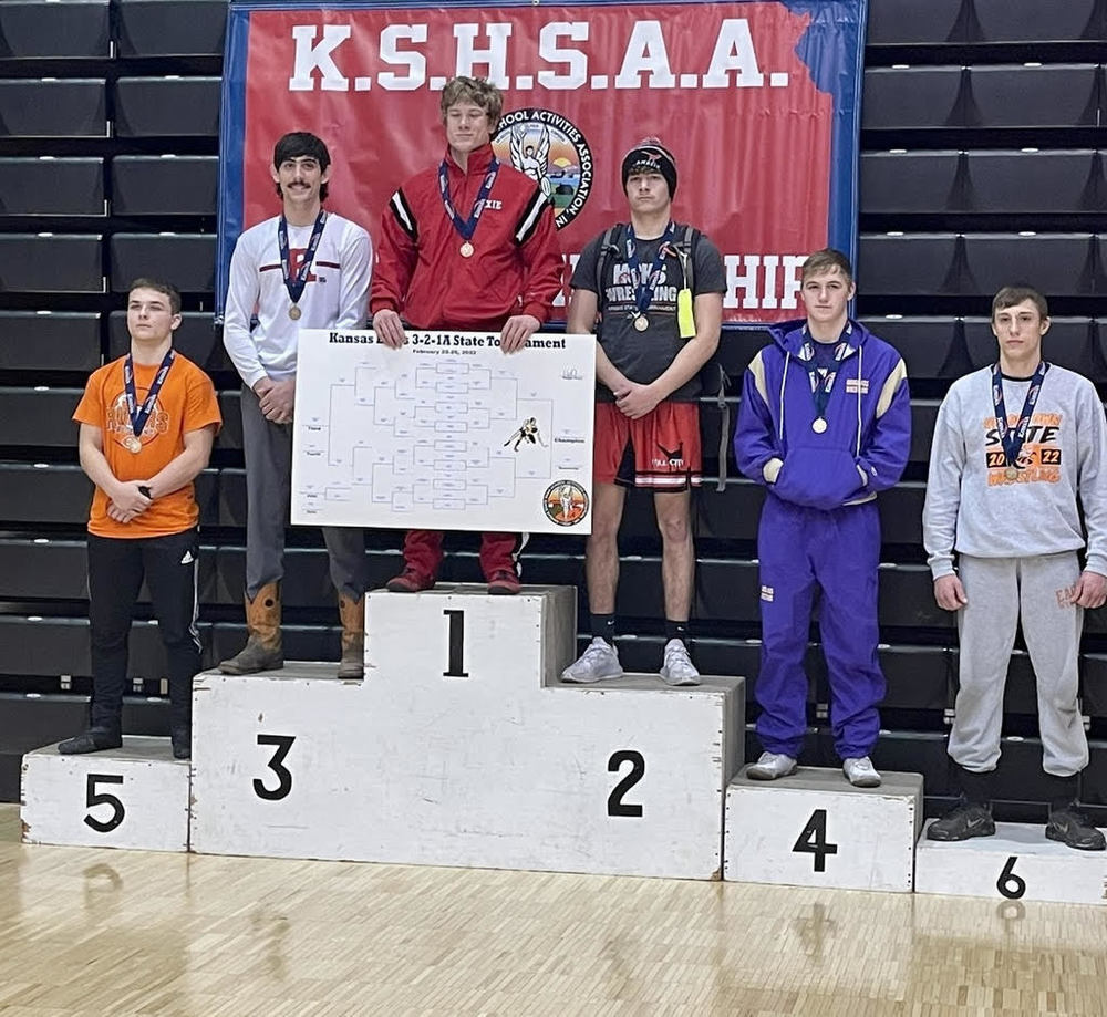 Picture of Bryce Eck receiving 6th place medal at State Wrestling
