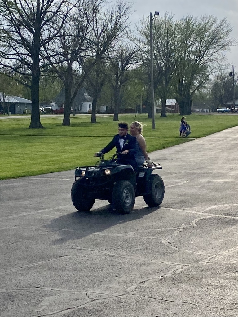 Students arriving at 2022 Prom on a 4-wheeler