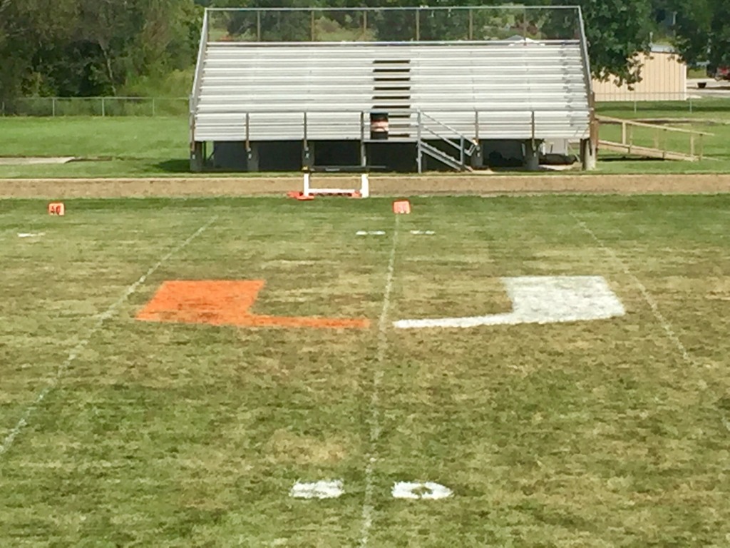 Picture of Uniontown Logo in the middle of the Football Field.